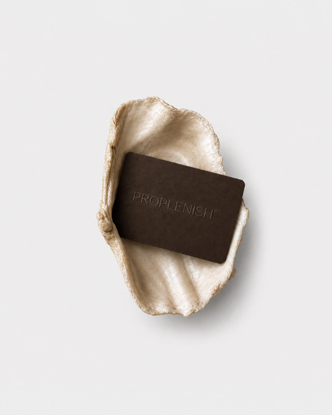 ProPlenish gift card displayed inside a white oyster shell on a light grey background.